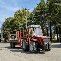 a tractor driving on a paved road