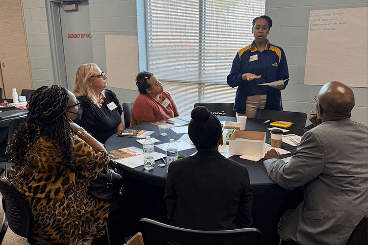 ChaNaè Bradley, senior communications specialist for Fort Valley State University’s Cooperative Extension Program, facilitates a post-disaster recovery group discussion during the Farm Stress Summit in Statesboro, Georgia.