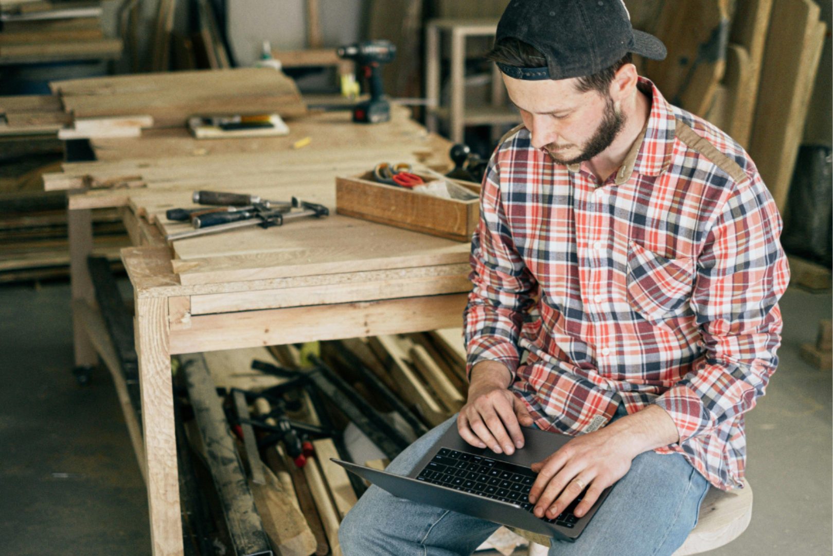person in a workshop on a computer