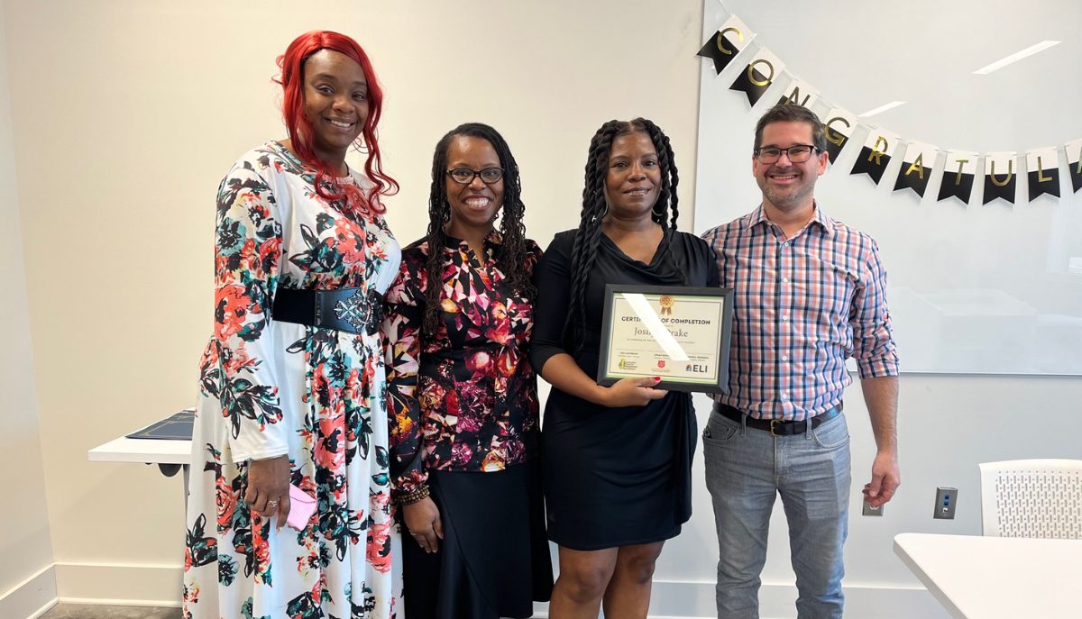 smiling program participant with a certificate