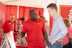 an Extension agent and a farmer talk discussing
