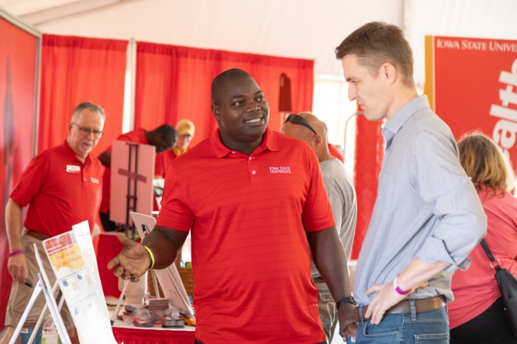 an Extension agent and a farmer talk discussing